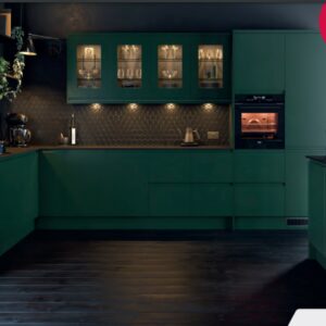 Matt dark fir green kitchen featuring handleless doors