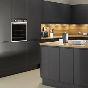 Matt anthracite kitchen featuring handleless doors with curved kitchen island