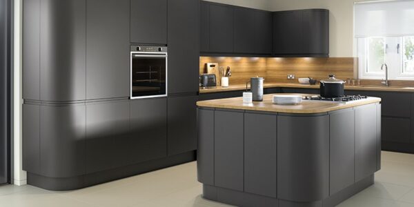 Matt anthracite kitchen featuring handleless doors with curved kitchen island