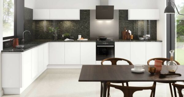 Matt white kitchen featuring handleless doors